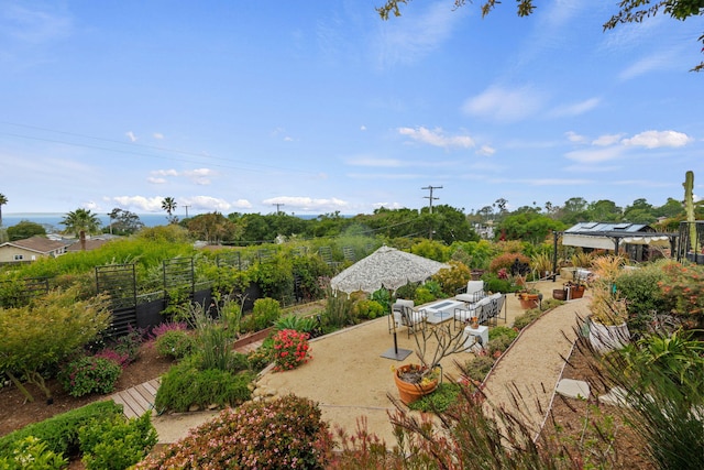 view of yard featuring a patio area and fence