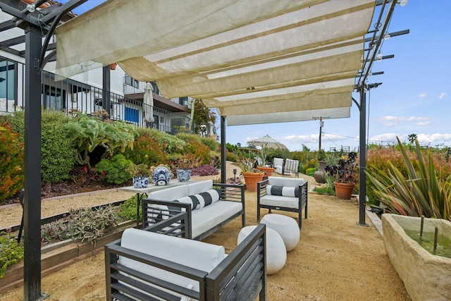 view of patio featuring a pergola and an outdoor living space