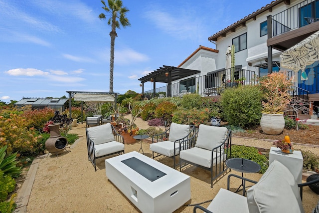 view of patio / terrace featuring a pergola and outdoor lounge area
