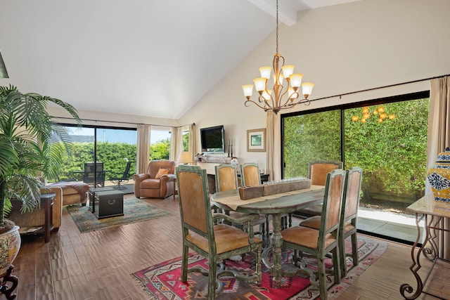 dining space featuring wood finished floors, a chandelier, high vaulted ceiling, and beamed ceiling