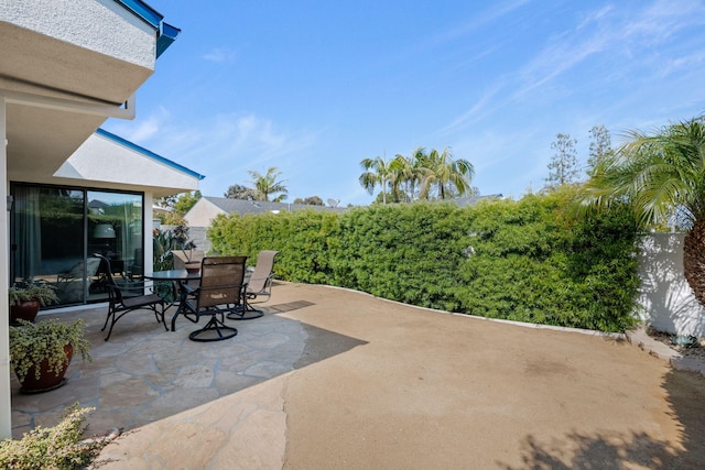 view of patio / terrace featuring outdoor dining area and a fenced backyard