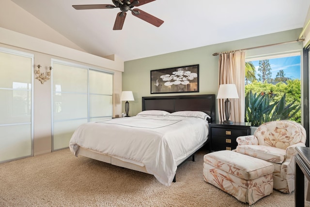 bedroom with a ceiling fan, lofted ceiling, and light carpet