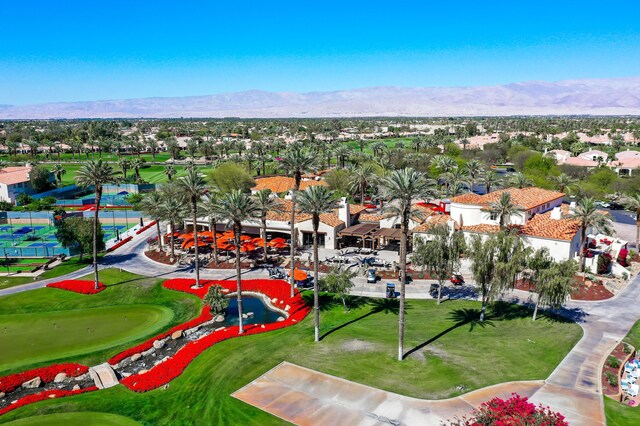 birds eye view of property with a residential view, view of golf course, and a mountain view