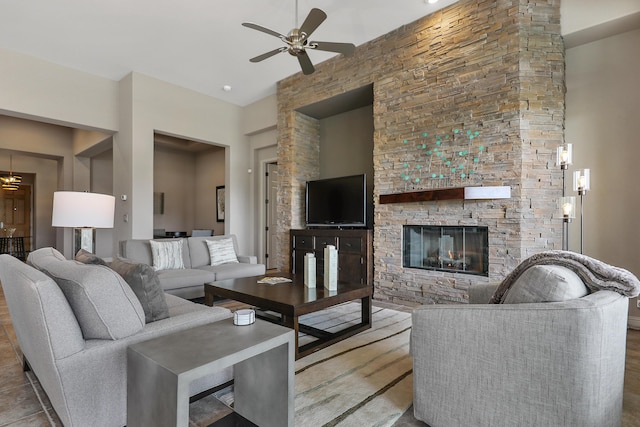 80220 Vía Tesoro, Tesoro, CA 92253 - living room with ceiling fan, a stone fireplace, and wood finished floors