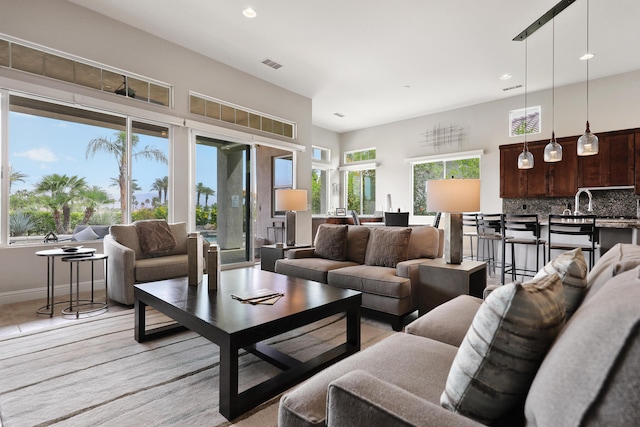 80220 Vía Tesoro, Tesoro, CA 92253 - living room featuring visible vents, recessed lighting, light wood-style flooring, and baseboards