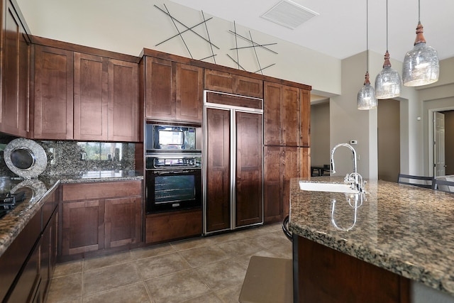 80220 Vía Tesoro, Tesoro, CA 92253 - kitchen featuring visible vents, hanging light fixtures, a sink, black appliances, and dark stone countertops