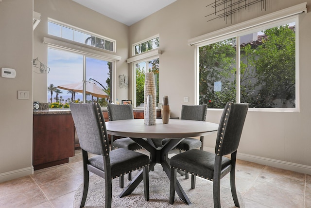80220 Vía Tesoro, Tesoro, CA 92253 - dining room with baseboards, light tile patterned floors, and a towering ceiling