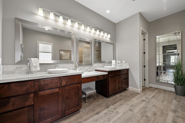 80220 Vía Tesoro, Tesoro, CA 92253 - full bath with double vanity, decorative backsplash, a sink, and wood finished floors