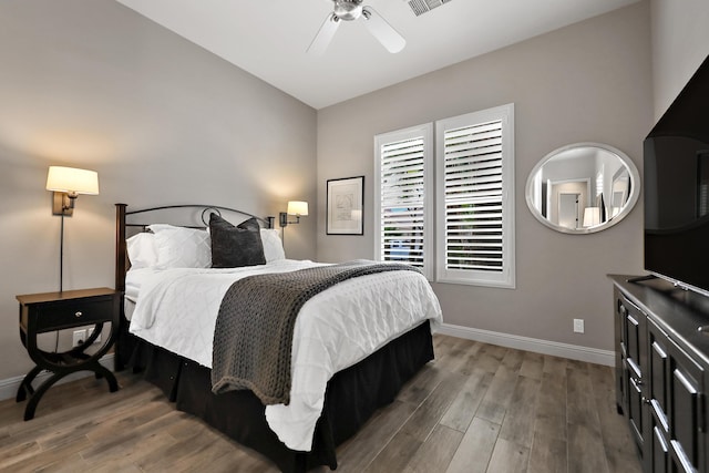 80220 Vía Tesoro, Tesoro, CA 92253 - bedroom featuring baseboards, ceiling fan, wood finished floors, and visible vents