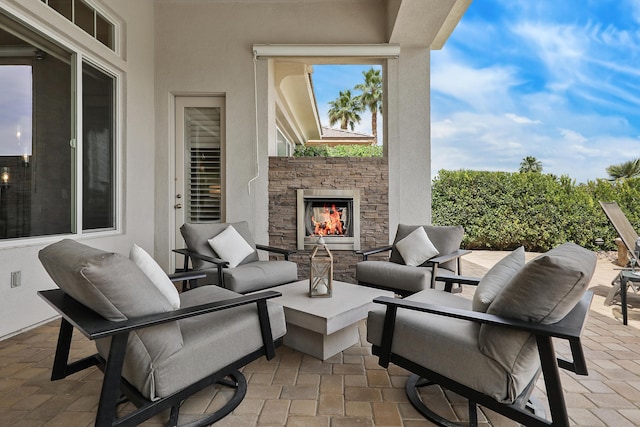 80220 Vía Tesoro, Tesoro, CA 92253 - view of patio / terrace with an outdoor living space with a fireplace