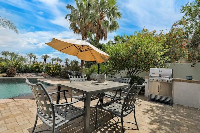 80220 Vía Tesoro, Tesoro, CA 92253 - view of patio with an outdoor kitchen, outdoor dining space, area for grilling, and an outdoor pool