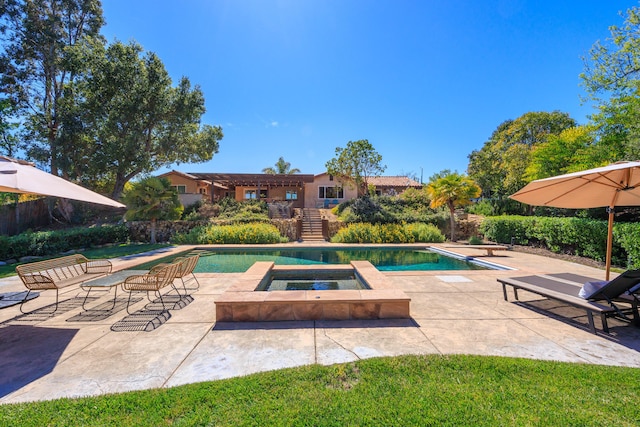 outdoor pool featuring stairway, a diving board, an in ground hot tub, and a patio area