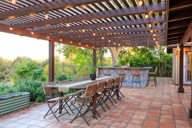 view of patio / terrace with a pergola and outdoor dry bar