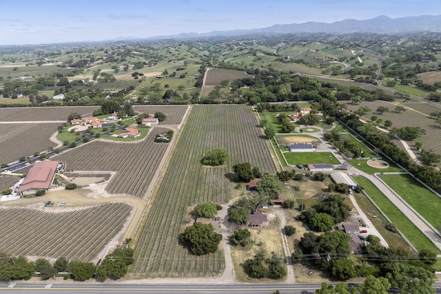 drone / aerial view featuring a rural view and a mountain view
