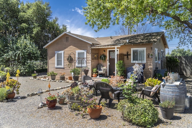 view of front of property featuring fence