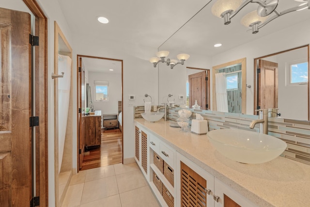 1158 Shelburn Ln, Ventura, CA 93001 - full bath featuring tile patterned flooring, a sink, decorative backsplash, and a healthy amount of sunlight