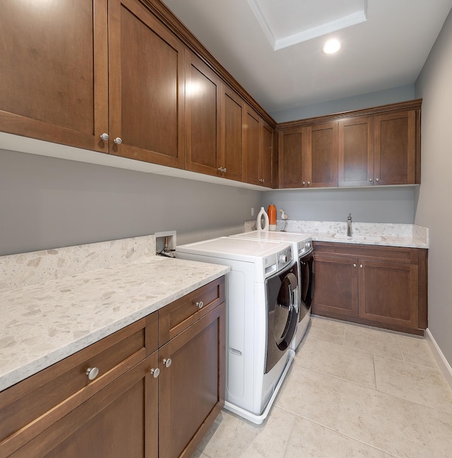 232 Sanderling Ln, Goleta, CA 93117 - laundry room featuring cabinet space, a sink, light tile patterned floors, recessed lighting, and washer and dryer