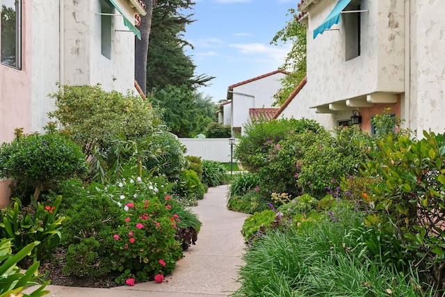view of home's community with fence