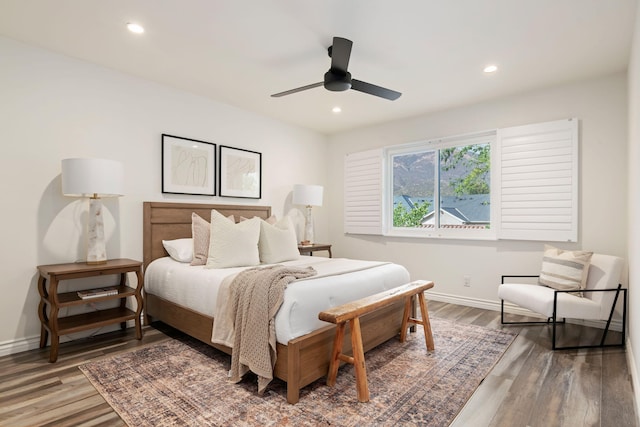 bedroom featuring wood finished floors, baseboards, recessed lighting, and a ceiling fan