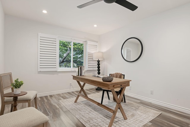 office featuring baseboards, ceiling fan, wood finished floors, and recessed lighting
