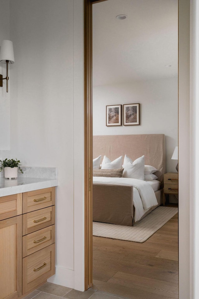 bedroom with light wood-style floors