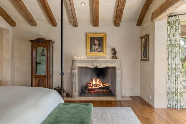 3325 Figueroa Mountain Rd, Los Olivos, CA 93460 - bedroom featuring wood finished floors, beamed ceiling, a premium fireplace, baseboards, and recessed lighting
