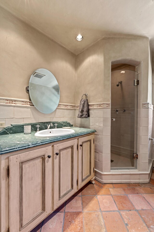 3325 Figueroa Mountain Rd, Los Olivos, CA 93460 - bathroom with a stall shower, vanity, stone tile floors, and recessed lighting