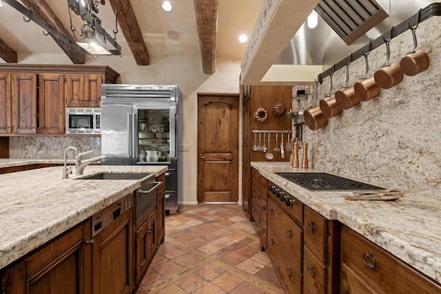 3325 Figueroa Mountain Rd, Los Olivos, CA 93460 - kitchen featuring built in appliances, beamed ceiling, inlaid floor details, decorative backsplash, and ventilation hood