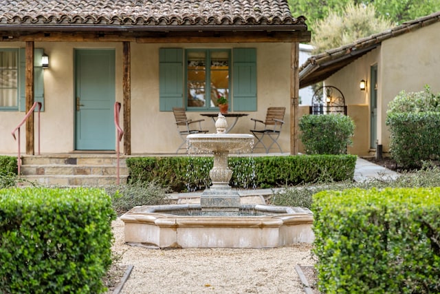 3325 Figueroa Mountain Rd, Los Olivos, CA 93460 - view of exterior entry featuring a tiled roof and stucco siding