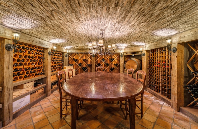 3325 Figueroa Mountain Rd, Los Olivos, CA 93460 - wine cellar with a chandelier and stone tile flooring