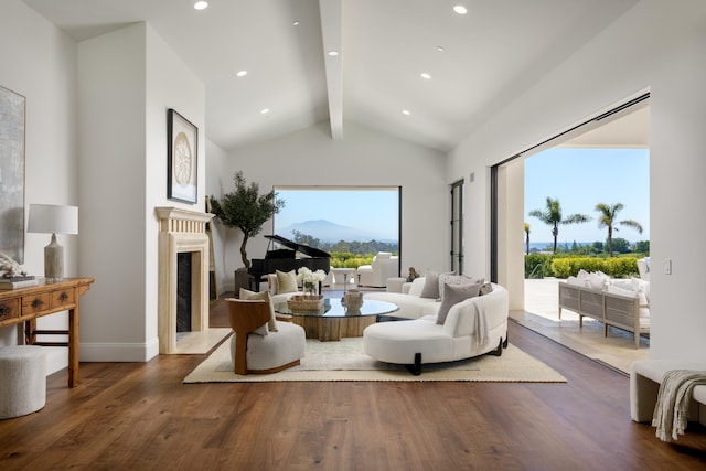 living room with lofted ceiling with beams, wood finished floors, recessed lighting, a fireplace, and baseboards