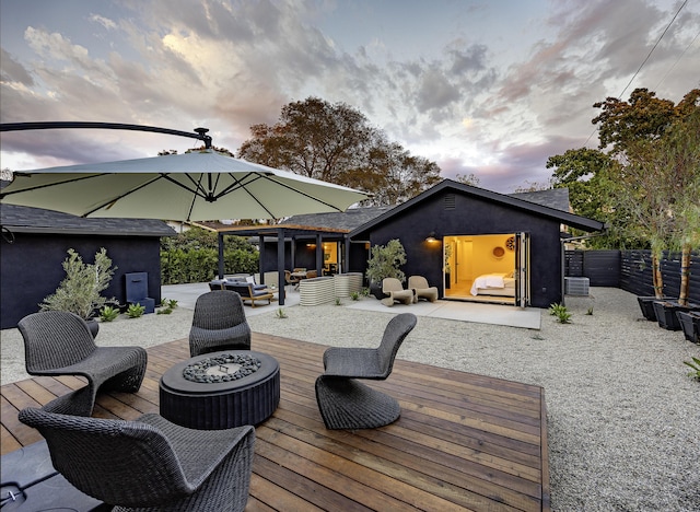 23 Calaveras Ave, Goleta, CA 93117 - wooden terrace featuring an outdoor living space with a fire pit and fence