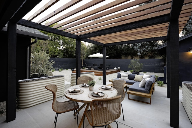 23 Calaveras Ave, Goleta, CA 93117 - view of patio featuring an outdoor hangout area, outdoor dining area, a pergola, and a fenced backyard
