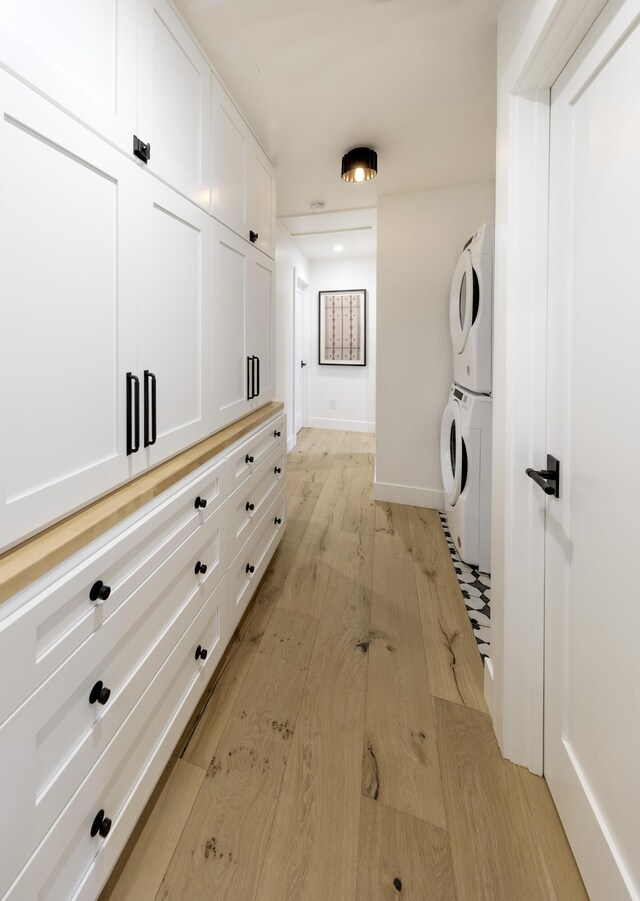 23 Calaveras Ave, Goleta, CA 93117 - interior space with baseboards, stacked washer and dryer, laundry area, and light wood-style floors