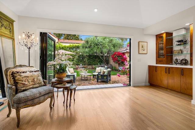 305 E Islay St, Santa Barbara, CA 93101 - sitting room featuring light wood finished floors, plenty of natural light, baseboards, and a notable chandelier