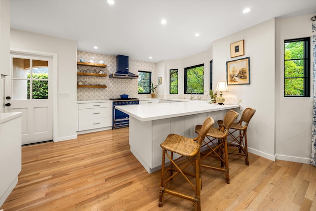 305 E Islay St, Santa Barbara, CA 93101 - kitchen with wall chimney range hood, plenty of natural light, and high end range