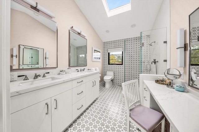 305 E Islay St, Santa Barbara, CA 93101 - bathroom with a sink, toilet, vaulted ceiling with skylight, and tile patterned floors