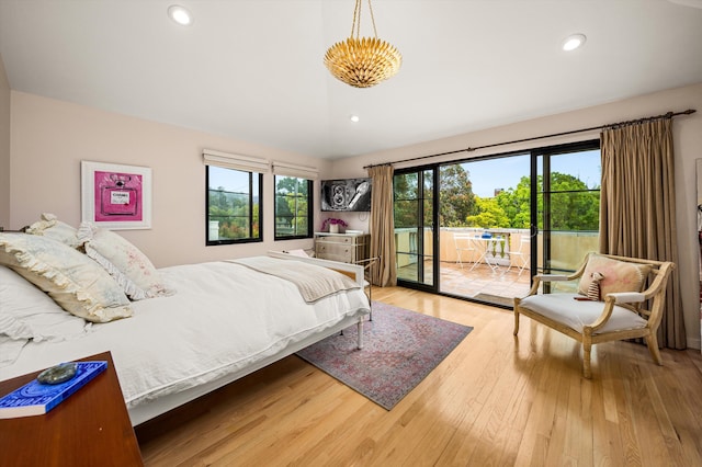 305 E Islay St, Santa Barbara, CA 93101 - bedroom featuring vaulted ceiling, multiple windows, access to outside, and wood finished floors