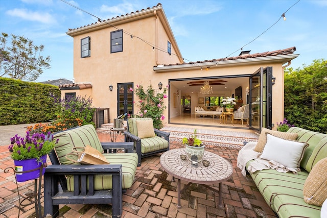 305 E Islay St, Santa Barbara, CA 93101 - rear view of house with an outdoor living space, a patio area, and stucco siding