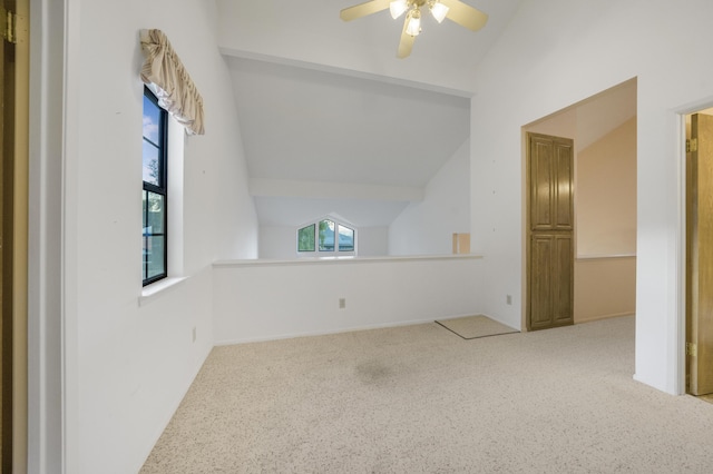 bonus room with lofted ceiling and a ceiling fan
