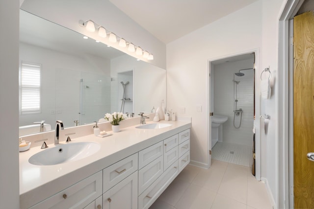 904 E Fir Ave, Lompoc, CA 93436 - full bathroom featuring a shower stall, double vanity, tile patterned floors, and baseboards