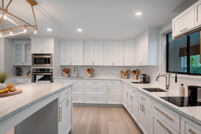 904 E Fir Ave, Lompoc, CA 93436 - kitchen with oven, a sink, backsplash, and recessed lighting
