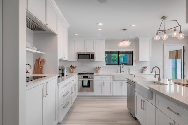 904 E Fir Ave, Lompoc, CA 93436 - kitchen with a sink, stainless steel appliances, light countertops, and recessed lighting