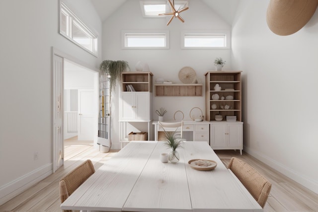 904 E Fir Ave, Lompoc, CA 93436 - dining area featuring high vaulted ceiling, light wood-style flooring, and baseboards