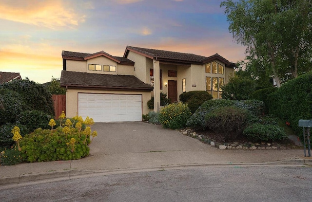 904 E Fir Ave, Lompoc, CA 93436 - view of front of property with driveway, stucco siding, and an attached garage