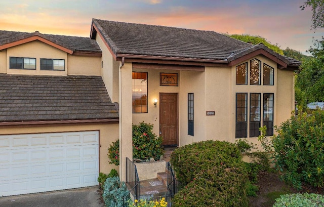 904 E Fir Ave, Lompoc, CA 93436 - view of front of property with stucco siding, a garage, and driveway