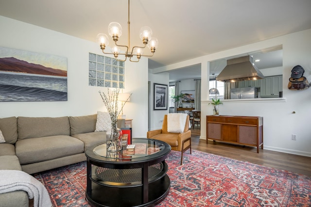 910 N Nopal St, Santa Barbara, CA 93103 - living room featuring a chandelier, wood finished floors, and baseboards