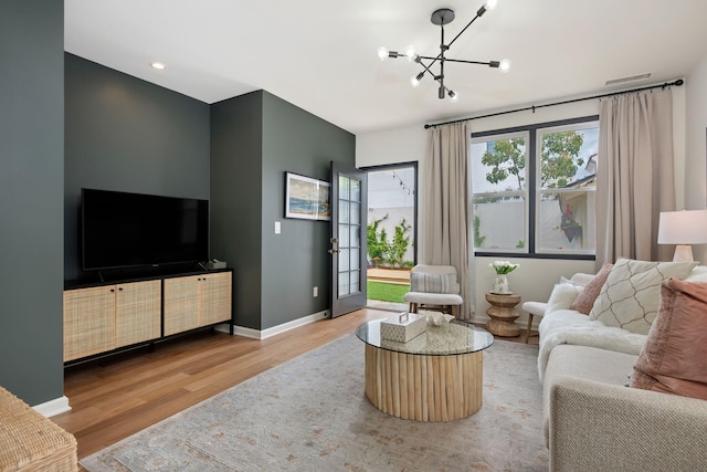 910 N Nopal St, Santa Barbara, CA 93103 - living area with wood finished floors, a chandelier, baseboards, and recessed lighting