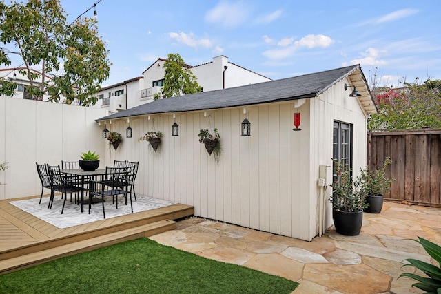910 N Nopal St, Santa Barbara, CA 93103 - view of outdoor structure featuring a fenced backyard, outdoor dining area, and an outdoor structure