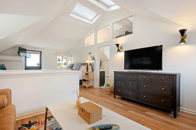 910 N Nopal St, Santa Barbara, CA 93103 - living area featuring a skylight, lofted ceiling, and light wood finished floors